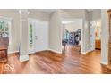 Inviting foyer with hardwood floors, natural light, and views into the living spaces at 15075 Windsor Ln, Noblesville, IN 46060