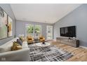 Bright living room features new wood floors, modern decor, and large windows for natural light at 16629 Greensboro Dr, Westfield, IN 46074