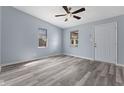 Bright and spacious living room with updated flooring, fresh paint, and plenty of natural light at 1739 N Alton Ave, Indianapolis, IN 46222