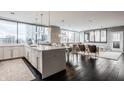 Bright living room featuring hardwood floors, modern furniture and city views at 225 N New Jersey St # 52, Indianapolis, IN 46204