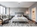Luxurious main bedroom with stylish decor, a comfortable bed and neutral colors at 225 N New Jersey St # 52, Indianapolis, IN 46204