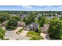 Aerial view of a residential neighborhood featuring a two-story home with a well-manicured front lawn at 2463 Kettering Way, Indianapolis, IN 46214