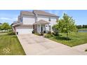 Beautiful two-story home showcasing a well-maintained front yard, tidy landscaping, and charming curb appeal at 2499 Blue Ridge Dr, Greenwood, IN 46143