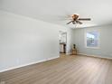 Airy living room featuring modern flooring, a ceiling fan, and views to the outside creating a comfortable space at 2811 Beech Dr, Columbus, IN 47203