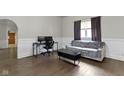 Comfortable living room with hardwood floors, desk space, and natural light at 29 E Caven St, Indianapolis, IN 46225