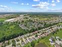 Aerial shot of neighborhood, featuring ponds, lush green landscaping, and convenient access to the city at 3341 Carica Dr, Indianapolis, IN 46203