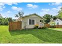 Charming home with fresh exterior and fenced yard with healthy lawn at 405 N Church St, Mooresville, IN 46158