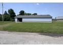 Exterior shot of home with open door and partial view of a parking lot at 4503 W Minnesota St, Indianapolis, IN 46241