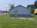 Exterior shot of home with door and view of a parking lot and a train at 4503 W Minnesota St, Indianapolis, IN 46241