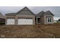 Charming single Gathering home features brick exterior, white garage doors, and architectural roofline details at 4999 Hummingbird Dr, Brownsburg, IN 46112