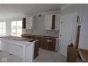 Spacious kitchen with white cabinets and a central island, ready for customization and appliances at 4999 Hummingbird Dr, Brownsburg, IN 46112