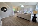 Spacious living room featuring vaulted ceilings, stylish decor, and an open layout at 6369 Kelsey Dr, Indianapolis, IN 46268