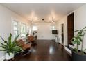 Bright living room with hardwood floors, stylish seating, and ample natural light at 702 S Keystone Ave, Indianapolis, IN 46203