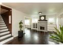 Inviting living room featuring a classic fireplace and hardwood floors at 702 S Keystone Ave, Indianapolis, IN 46203