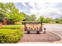 Lions Head Private Condominium Residences sign surrounded by green landscaping and mature trees at 7317 Lions Head Dr # A, Indianapolis, IN 46260