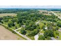 Aerial view of property lines amid lush greenery, highlighting the spacious layout and potential at 7516 S County Road 300 W, Clayton, IN 46118