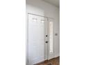 Bright white front door with glass accents, leading to a welcoming interior at 7685 River Rd, Indianapolis, IN 46240