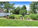 Large backyard featuring a well-tended vegetable garden with mature plants at 8019 E Hanna Ave, Indianapolis, IN 46239