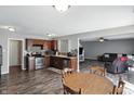 Open concept kitchen with stainless steel appliances and dark wood cabinets at 8301 Wheatfield Dr, Camby, IN 46113