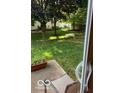 View of the backyard showcasing a patio area and lush lawn, perfect for outdoor at 8326 Alcona Dr, Indianapolis, IN 46237