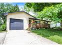 Well-maintained single-story home with attached garage and cozy front porch at 9042 Panorama Ct, Indianapolis, IN 46234