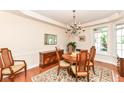 Traditional dining room featuring hardwood floors, a chandelier, and elegant furnishings at 10005 Southwind Dr, Indianapolis, IN 46256