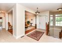 Welcoming foyer with tile flooring, chandelier, and an open view to the dining room at 10005 Southwind Dr, Indianapolis, IN 46256