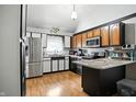 Well-lit kitchen featuring two-toned cabinets, stainless steel appliances, and durable countertops at 1106 Summer Way Ct, Shelbyville, IN 46176