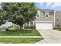 Inviting two-story home with a well-maintained lawn and a two-car garage at 1236 N Aberdeen Dr, Franklin, IN 46131