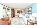 Bright living room featuring a large window, comfortable seating, and stylish decor at 1237 Driftwood Dr, Carmel, IN 46033