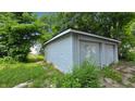 Spacious detached two-car garage with ample storage, surrounded by green lawn and mature trees at 1427 N Lasalle St # 1427, Indianapolis, IN 46201