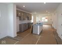 Bright, unfinished kitchen with large center island, and modern gray cabinetry at 1817 Real St, Indianapolis, IN 46240