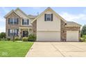 Two-story home featuring brick accents, neutral siding, and a three-car attached garage at 360 Myers Lake Dr, Noblesville, IN 46062