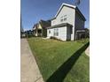 A charming home boasts a lush green lawn and inviting curb appeal at 46 S Warman S Ave, Indianapolis, IN 46222