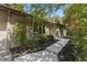 Beautiful brick house with mature landscaping and a concrete walkway leading to the front entrance at 604 Oak Blvd W Dr, Greenfield, IN 46140