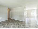 Spacious living area with gray walls and modern flooring leading to other rooms at 609 Willow Dr, Shelbyville, IN 46176