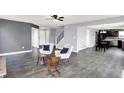 Open concept living space with modern floors, neutral paint, and seamless flow to kitchen at 7865 Danube St, Indianapolis, IN 46239