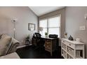 Comfortable office featuring a wooden desk, chair, and a window for natural light at 1106 Barbara Dr, Greenwood, IN 46143