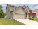 Attractive home with a well-kept lawn, attached garage, and a welcoming front porch at 1156 Brockton Ct, Greenfield, IN 46140