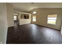 Spacious living room with modern flooring, neutral walls, and bright natural light at 11726 Pawleys Ct, Indianapolis, IN 46235