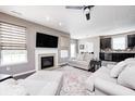 Inviting living room with cozy fireplace, recessed lights, and plenty of space for entertaining at 1187 Blackthorne S Trl, Plainfield, IN 46168