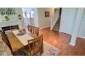 Inviting dining room featuring hardwood floors and an adjacent staircase at 1201 Fantail Dr, Greenwood, IN 46143