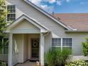 View of a front door with a wreath, covered entry, and manicured landscaping at 1201 Fantail Dr, Greenwood, IN 46143