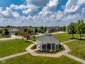 Community gazebo in a park-like setting, with lush green grass and mature trees at 1201 Fantail Dr, Greenwood, IN 46143