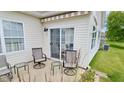 Outdoor patio with comfortable seating, perfect for enjoying the serene backyard views at 1201 Fantail Dr, Greenwood, IN 46143