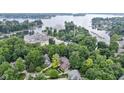 An aerial view highlights proximity to lake, boating and mature landscaping at 12214 Ridgeside Rd, Indianapolis, IN 46256