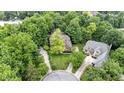 Birds-eye view showcases this home's mature trees, landscaping and circular drive at 12214 Ridgeside Rd, Indianapolis, IN 46256