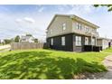 This beautiful home boasts a lush green lawn and a classic two-story design at 1302 Main St, Elwood, IN 46036