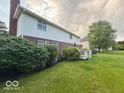 Spacious backyard with a view of the house, landscaping, and deck at 13221 Griffin Run, Carmel, IN 46033