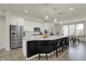 Open concept kitchen with a large island, modern appliances, and a dining area at 16057 Coleman Dr, Westfield, IN 46074